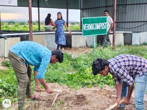 Filling of manure in vermi compost pits by second year diploma students (1)