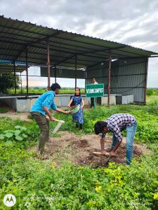 Filling of manure in vermi compost pits by second year diploma students (2)