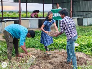 Filling of manure in vermi compost pits by second year diploma students (4)