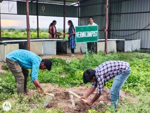 Filling of manure in vermi compost pits by second year diploma students (5)